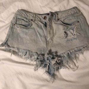 Light wash distressed jean shorts.
